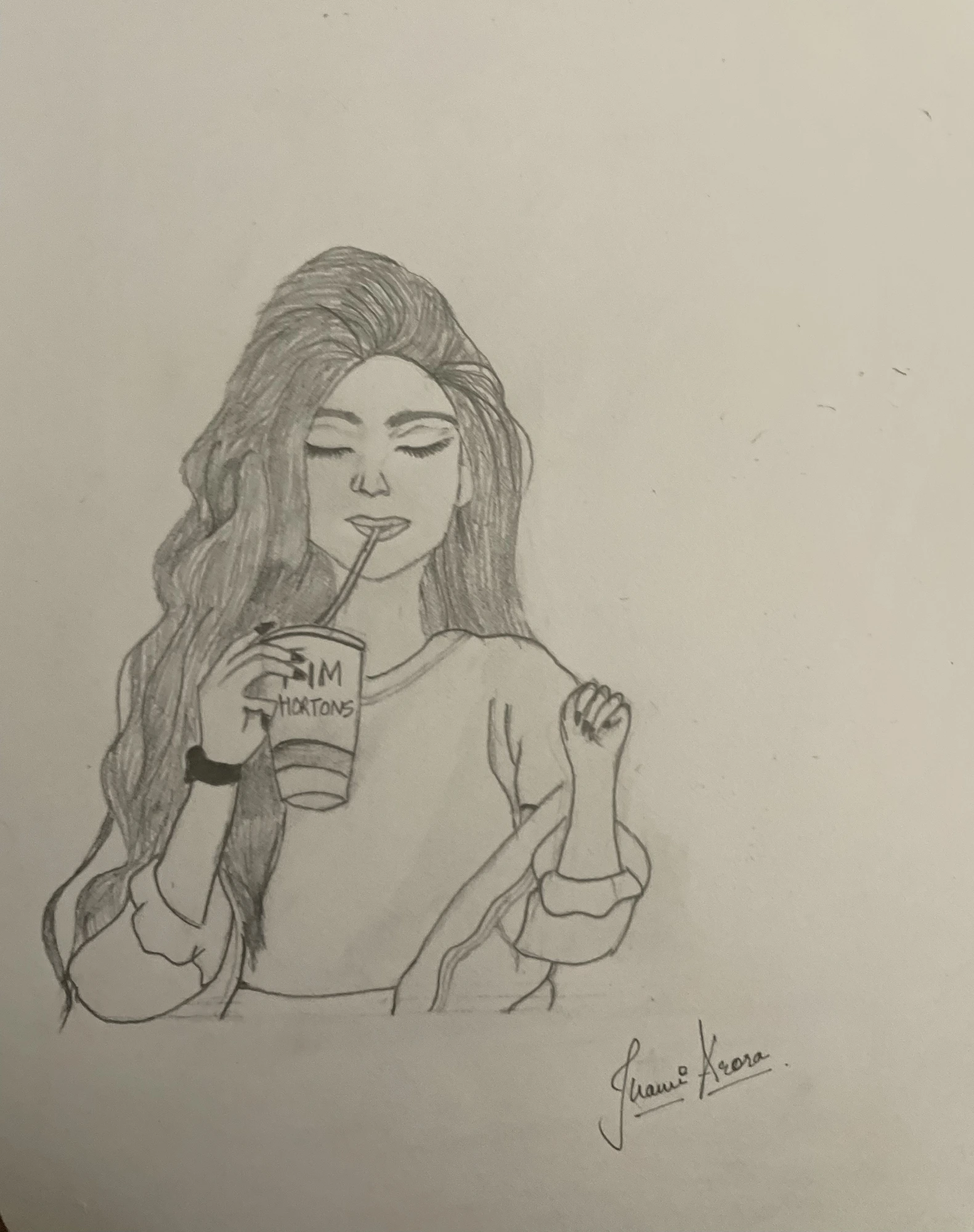 Pencil self-portrait sipping a coffee, signed Jhanvi Arora